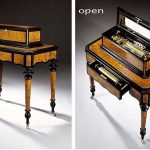 AN ATTRACTIVE SWISS BURR WALNUT EBONIZED INTERCHANGEABLE CYLINDER MUSIC BOX ON TABLE, CIRCA 1870