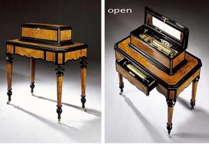 AN ATTRACTIVE SWISS BURR WALNUT EBONIZED INTERCHANGEABLE CYLINDER MUSIC BOX ON TABLE, CIRCA 1870