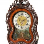 A DUTCH CARVED WALNUT QUARTER STRIKING AUTOMATON TABLE CLOCK WITH MUSICAL MOVEMENT